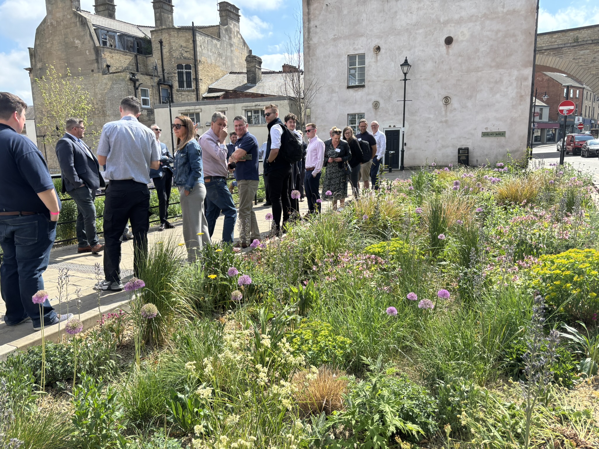 A group of SuDS professionals looking at some SuDS in Mansfield