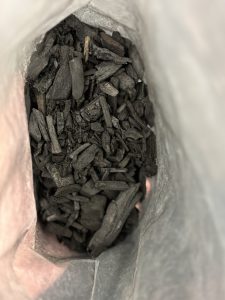 A bag of biochar which is being used to improve soils on this road scheme.