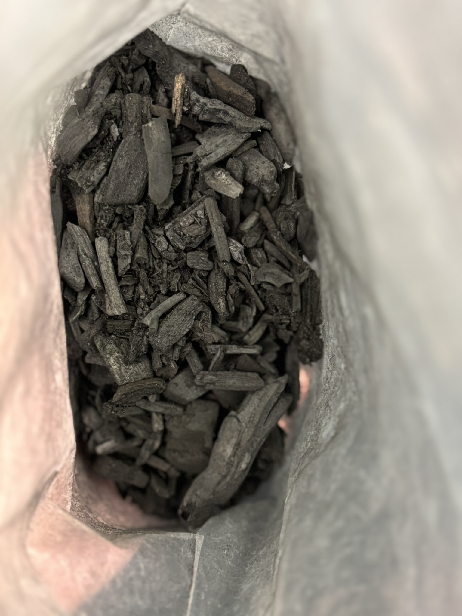 A bag of biochar which is being used to improve soils on this road scheme.