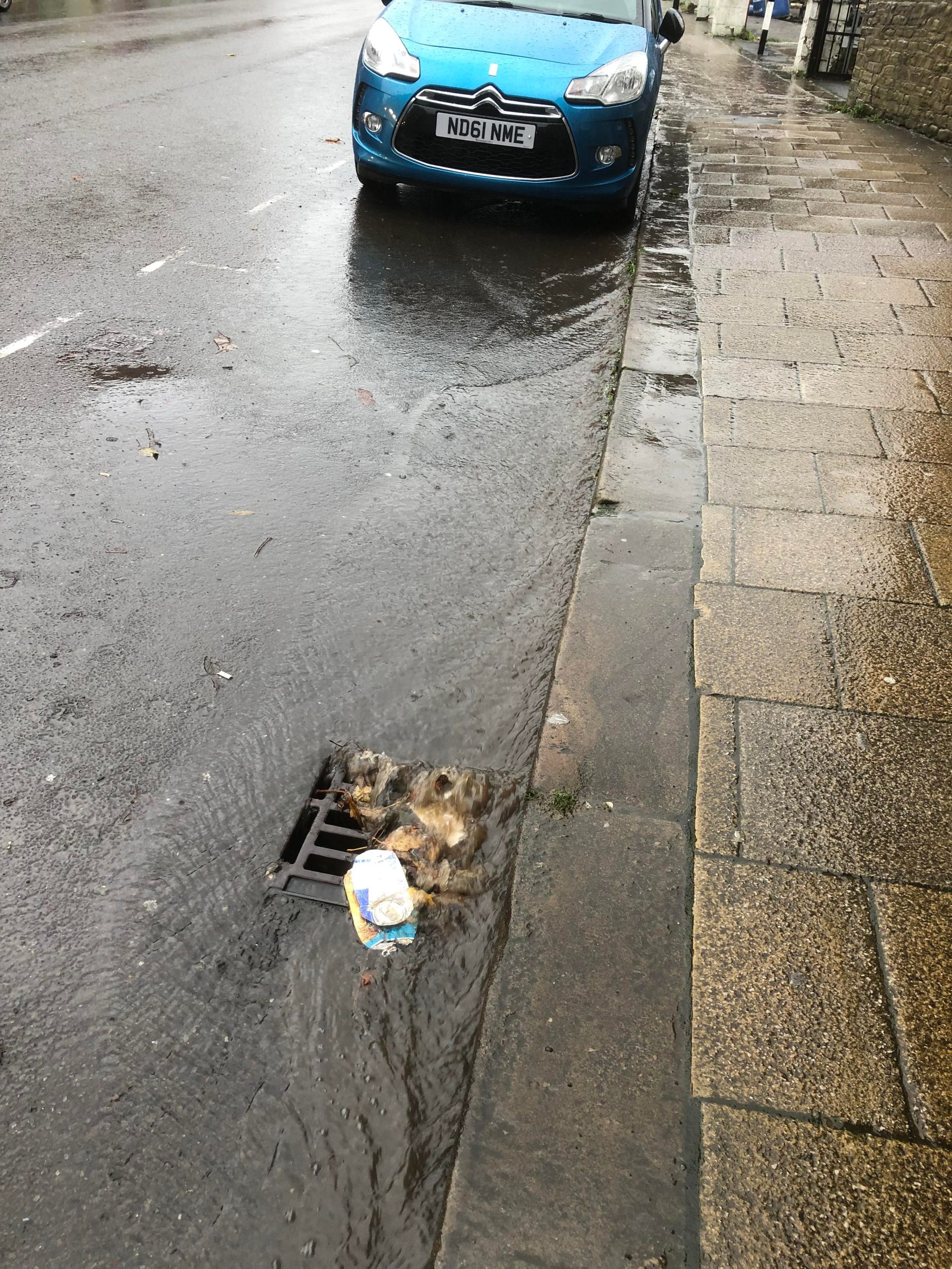 Urban runoff rushing down a street